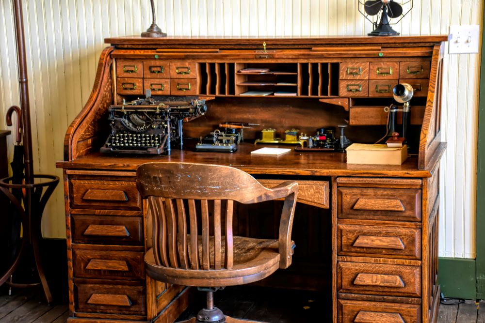 Use Antiques to Heighten a Desk’s Charm